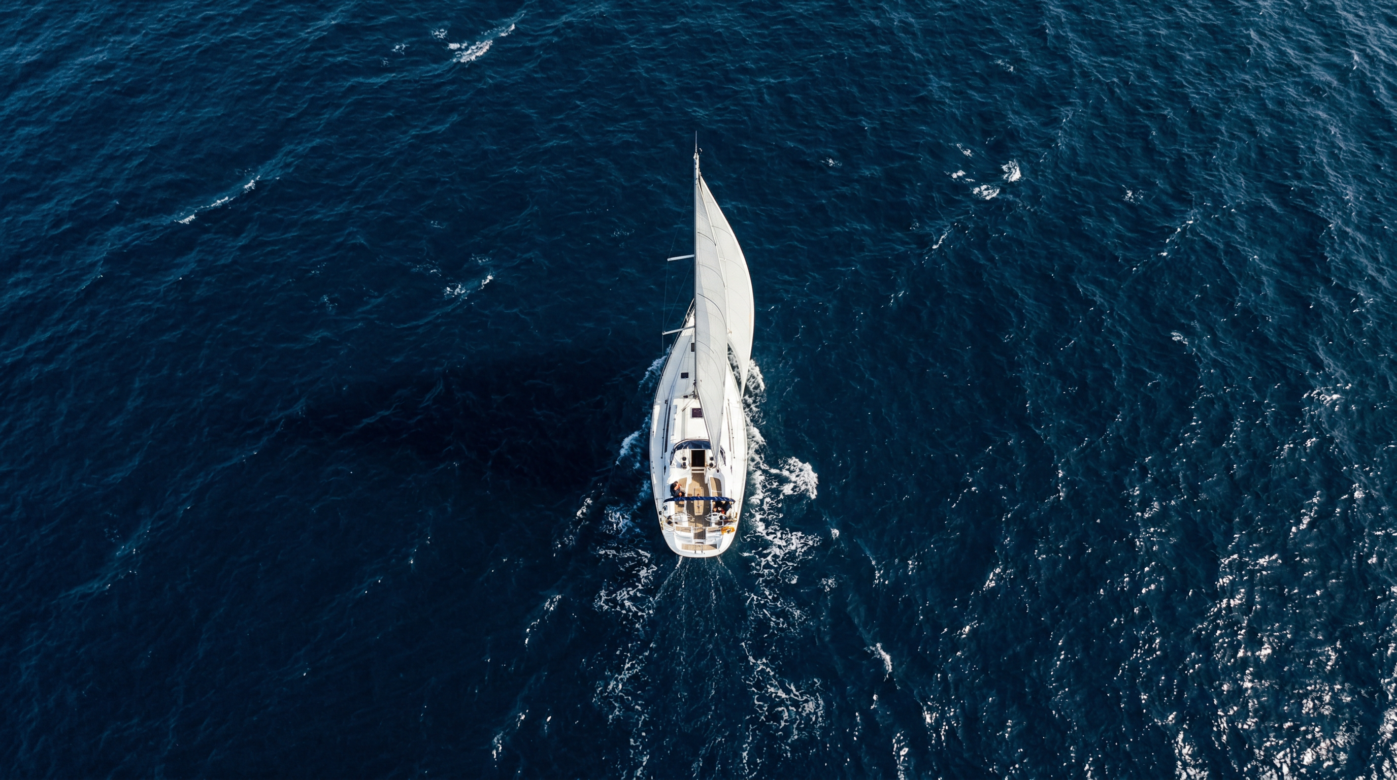 Aerial view of sailboat on ocean